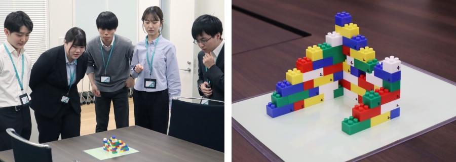 ＜ 複雑なブロックタワーの構造を覚えようと真剣に見本を確認 ＞